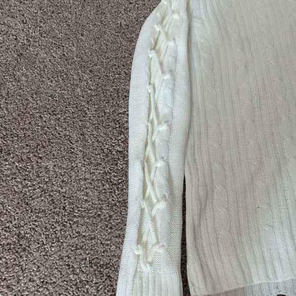 selling a pink angel sweater,colour is just white and the size is US (16) XL. - Picture 3 of 4